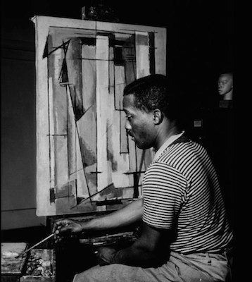 Norman Lewis working on Composition I, 1945. Courtesy Willard Gallery Archives