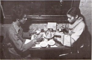 Cockeyed Clams — A couple seated eating.