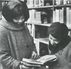 Mother and Daughter Perusing a Book