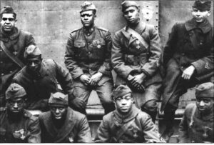 Enlisted men of the 369th R.I.U.S, (15th New York) on a ship returning from France, all decorated with the "French Croix de Guerre."Salutes to the Harlem Hellfighters