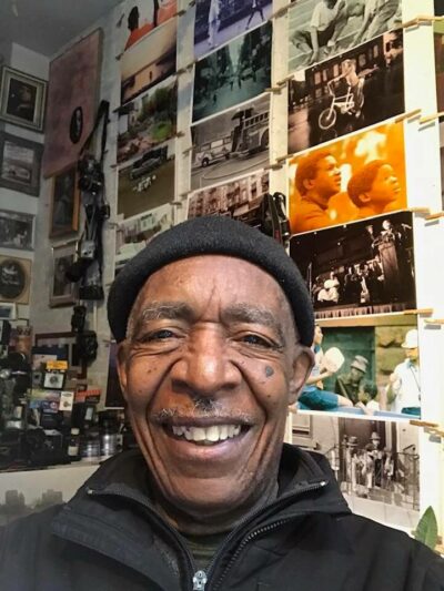 Alex Harsley may 2020 standing in his studio smiling