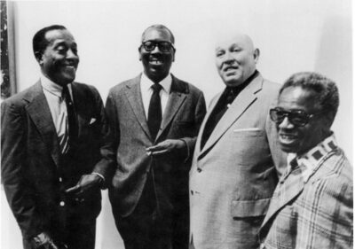 Former “306” colleagues. Norman Lewis, Jacob Lawrence, Romare Bearden, Ernest Crichlow. c 1970.