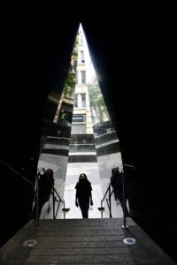 monument – a girl stops and reflects on the entrance to the African burial monument.
