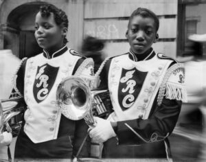 Dawoud Bey, Two Girls from a Marching Band, Harlem, NY, 1990. Pigmented inkjet print (printed 2019), 30 x 40 in. (76.2 x 101.6 cm); Frame: 41 1/8 x 50 1/8 x 2 1/8 in. Collection of the artist; courtesy Sean Kelly Gallery, New York; Stephen Daiter Gallery, Chicago; and Rena Bransten Gallery, San Francisco. © Dawoud Bey. 