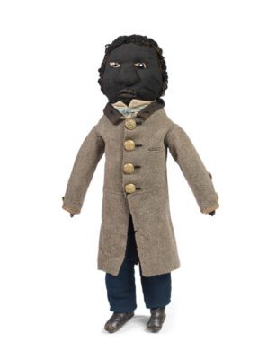 Doll in gentleman’s top coat, 1860-70 Milton, MA Mixed fabrics, leather, brass, glass Deborah Neff Collection Photo: Ellen McDermott Photography