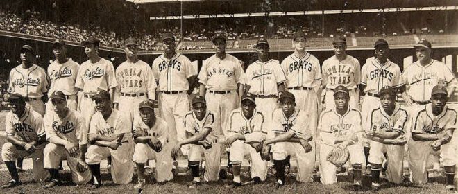 East Team, 1948 Negro league East–West All-Star Game, Comiskey Park, Chicago, Illinois. Back row: Lester Lockett, Monte Irvin, Rufus Lewis, Henry Miller, Luke Easter, Robert Griffith, Pat Scantlebury, Wilmer Fields, Bill Cash, Vic Harris and manager Jose Fernandez. Front row: Buck Leonard, Bob Harvey, Marvin Barker, Frank Austin, Pee Wee Buts, Minnie Minoso, Luis Marquez, Louis Louden, Bob Romby, Junior Gilliam.