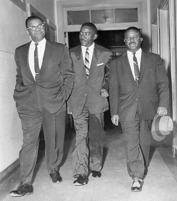 Reverend Gardner C. Taylor (far left) and friends visit Rev. Martin Luther King Jr. at Harlem Hospital.