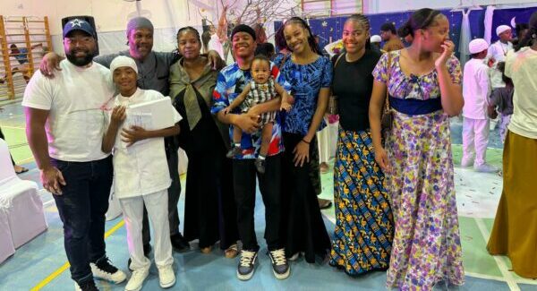 The group photo is of my stepson Avraham’s family. He’s the 2nd from left adult (wearing gray keeps? That’s his wife Ahuda and the mother of the graduate (wearing white) Orkhai and all the other children. Everyone from left to right: -Avraham Jr. , graduate Orkhai (12), Avraham Sr., Ahuda (mother of Orkhai), Liran (age 14, holding baby brother Yikheeyah, 11 mos.), Karaliyah (16), Yofeeyah (20), Lirone (14 and twin to Liran).